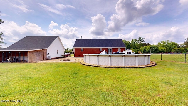 106 Ehrhardt Way, Princeton, NC 27569 - back of property with a lawn, an outdoor pool, fence, and brick siding