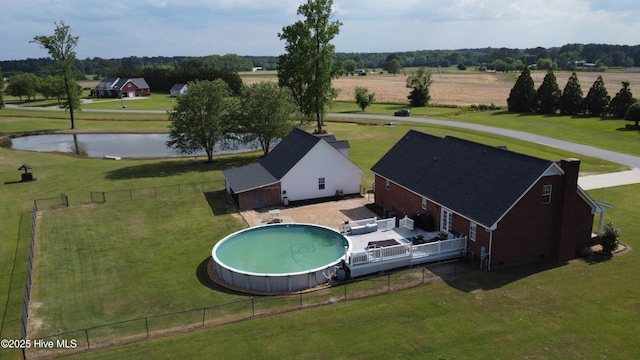 106 Ehrhardt Way, Princeton, NC 27569 - view of pool with a lawn, a water view, a fenced backyard, and a fenced in pool