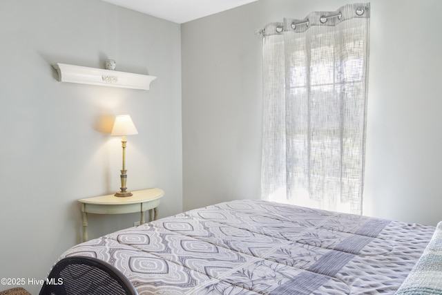 bedroom with multiple windows