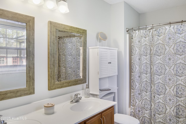 full bath featuring toilet and vanity