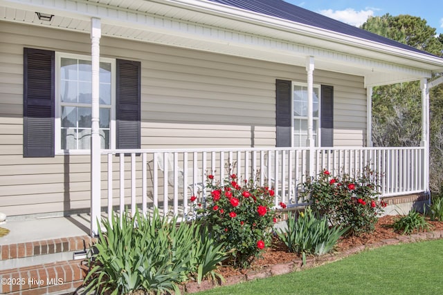 view of property exterior featuring covered porch