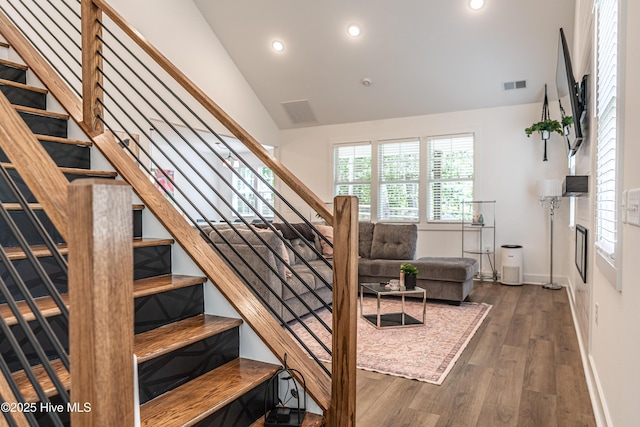 102 Dartmoor Ln, West End, NC 27376 - stairway featuring recessed lighting, visible vents, vaulted ceiling, baseboards, and wood finished floors