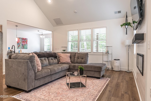 102 Dartmoor Ln, West End, NC 27376 - living area featuring visible vents, high vaulted ceiling, and dark wood-type flooring