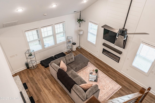 102 Dartmoor Ln, West End, NC 27376 - living room with baseboards, visible vents, wood finished floors, and vaulted ceiling