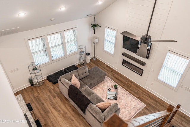 102 Dartmoor Ln, West End, NC 27376 - living area with visible vents, baseboards, recessed lighting, vaulted ceiling, and wood finished floors