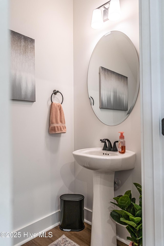 102 Dartmoor Ln, West End, NC 27376 - bathroom with baseboards and wood finished floors