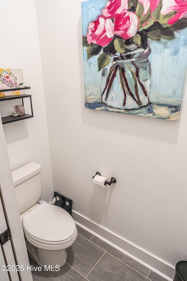 102 Dartmoor Ln, West End, NC 27376 - bathroom featuring baseboards, tile patterned floors, and toilet