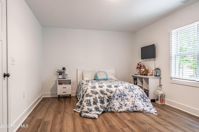 102 Dartmoor Ln, West End, NC 27376 - bedroom featuring wood finished floors and baseboards