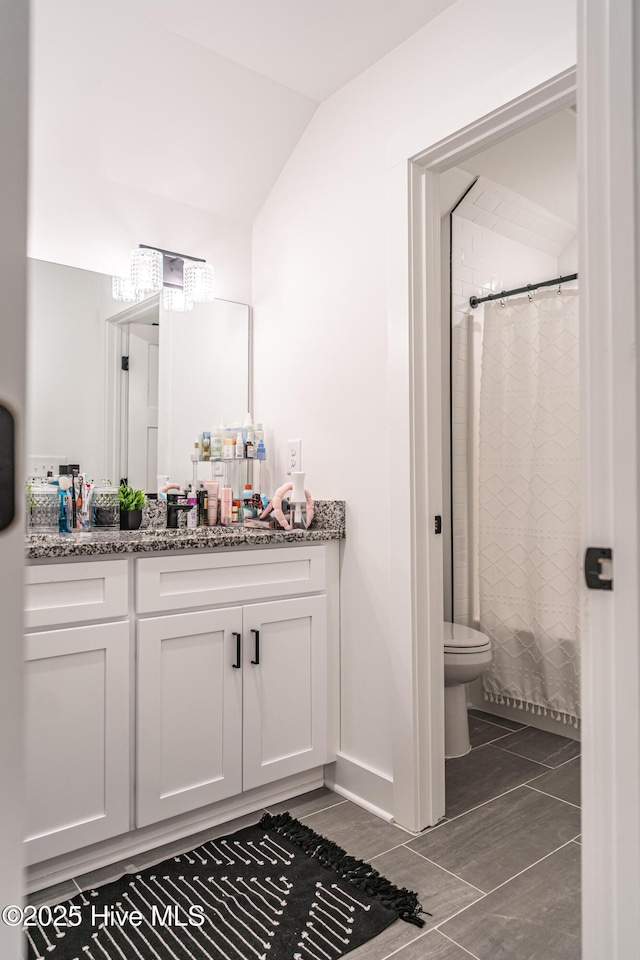 102 Dartmoor Ln, West End, NC 27376 - bathroom with vanity, toilet, a shower with shower curtain, and vaulted ceiling