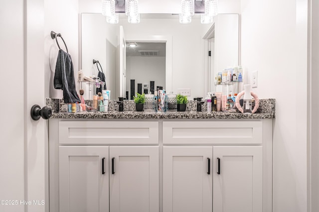 102 Dartmoor Ln, West End, NC 27376 - bathroom featuring visible vents, an inviting chandelier, and vanity