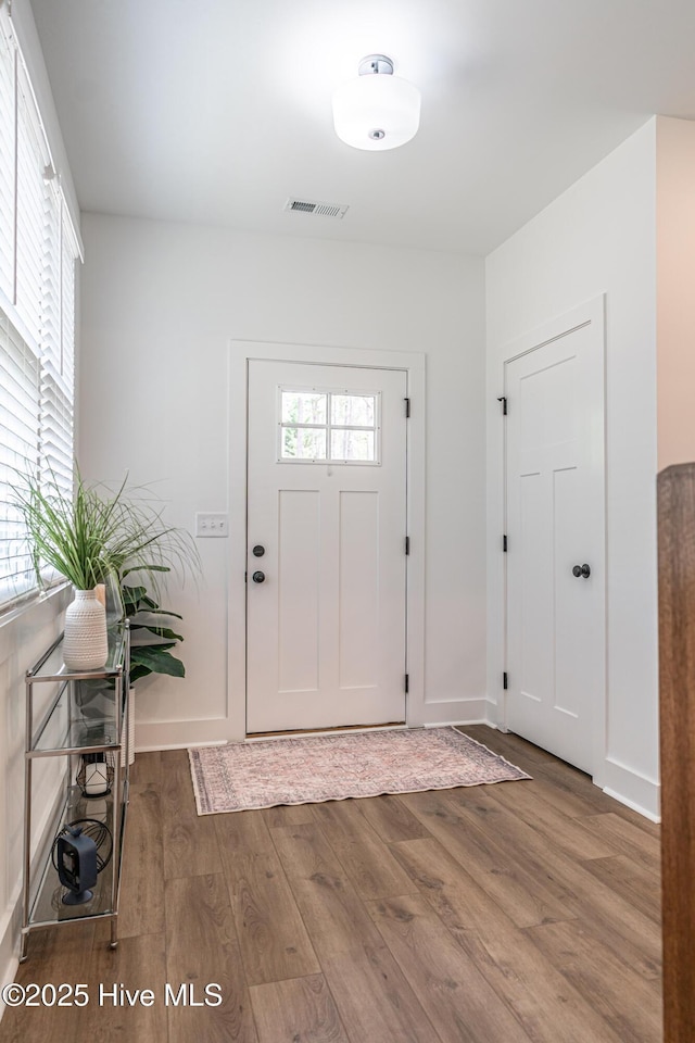 102 Dartmoor Ln, West End, NC 27376 - foyer featuring wood finished floors, visible vents, and baseboards