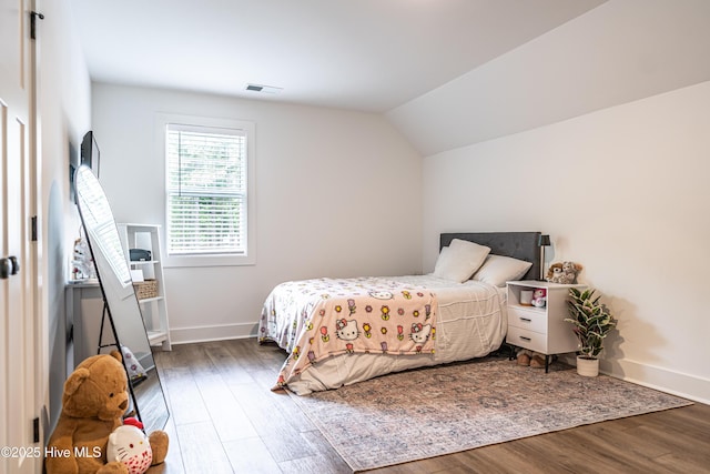 102 Dartmoor Ln, West End, NC 27376 - bedroom featuring visible vents, vaulted ceiling, wood finished floors, and baseboards