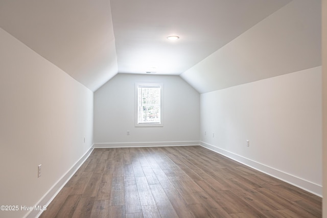 102 Dartmoor Ln, West End, NC 27376 - bonus room featuring dark wood finished floors, baseboards, and vaulted ceiling
