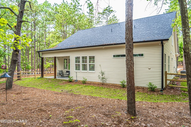 102 Dartmoor Ln, West End, NC 27376 - view of side of home with roof with shingles and fence