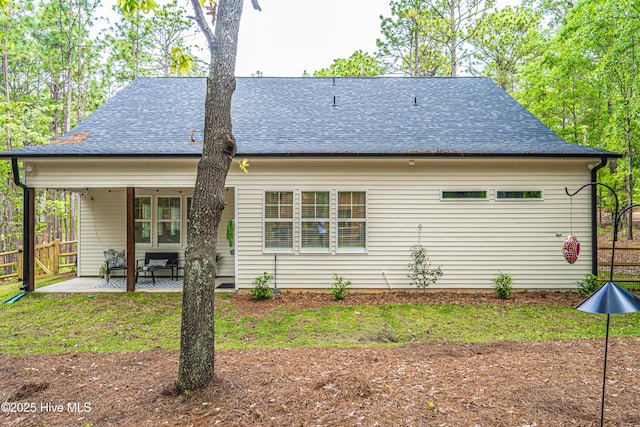 102 Dartmoor Ln, West End, NC 27376 - back of house with fence, a shingled roof, and a patio