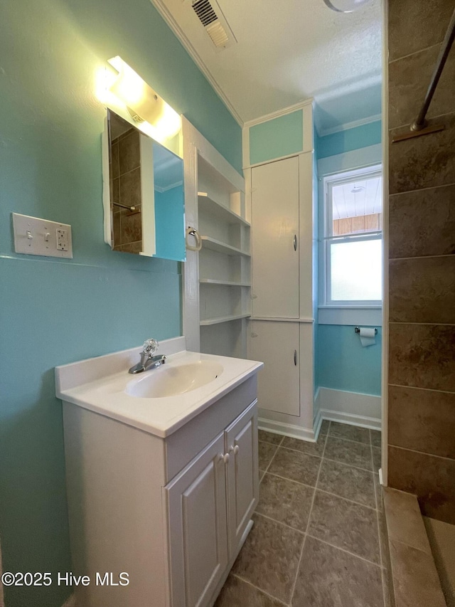 469 Lamont St, Belhaven, NC 27810 - bathroom with tile patterned flooring, crown molding, vanity, and visible vents