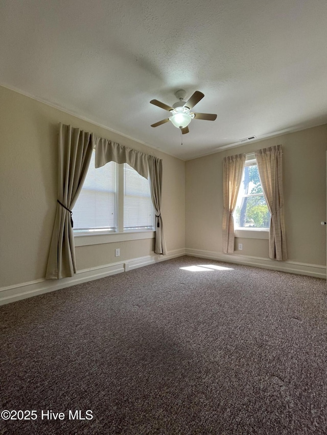 469 Lamont St, Belhaven, NC 27810 - empty room with ceiling fan, baseboards, carpet flooring, and a textured ceiling
