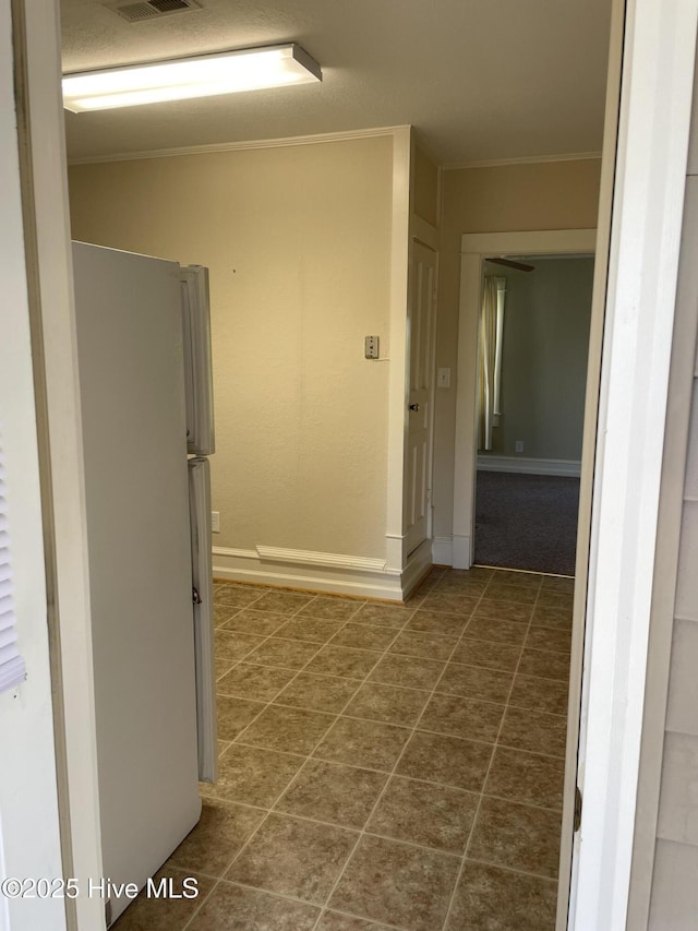 469 Lamont St, Belhaven, NC 27810 - corridor featuring baseboards, visible vents, and ornamental molding