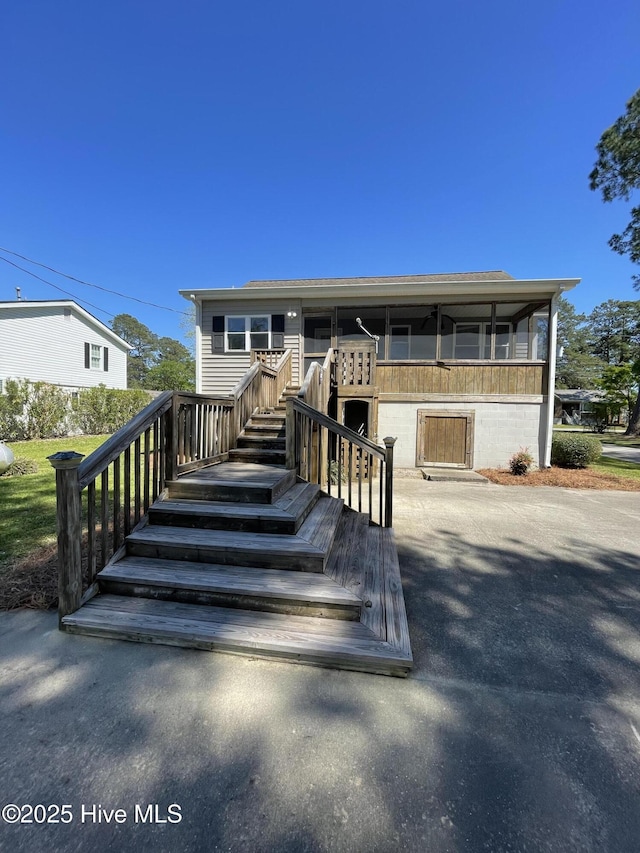 469 Lamont St, Belhaven, NC 27810 - view of front facade with a sunroom and stairs