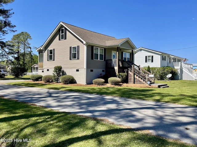 469 Lamont St, Belhaven, NC 27810 - view of front of home with a porch, a front yard, and stairs