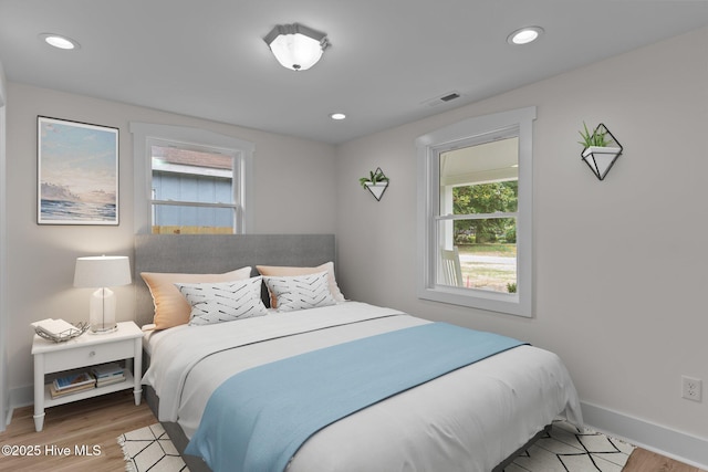 822 N Lord St, Southport, NC 28461 - bedroom featuring recessed lighting, visible vents, light wood-style floors, and baseboards