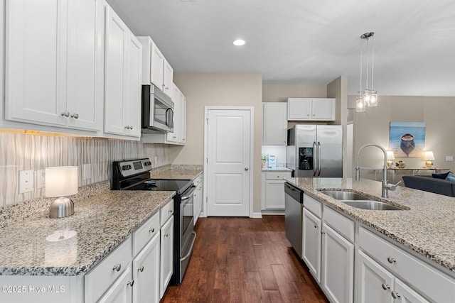 1699 Haldon Ln SE, Bolivia, NC 28422 - kitchen with a sink, stainless steel appliances, white cabinetry, and dark wood-type flooring