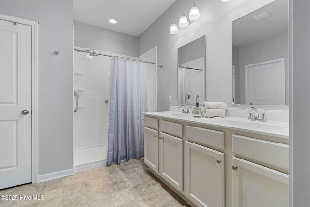 1699 Haldon Ln SE, Bolivia, NC 28422 - bathroom with a sink, a tile shower, and double vanity