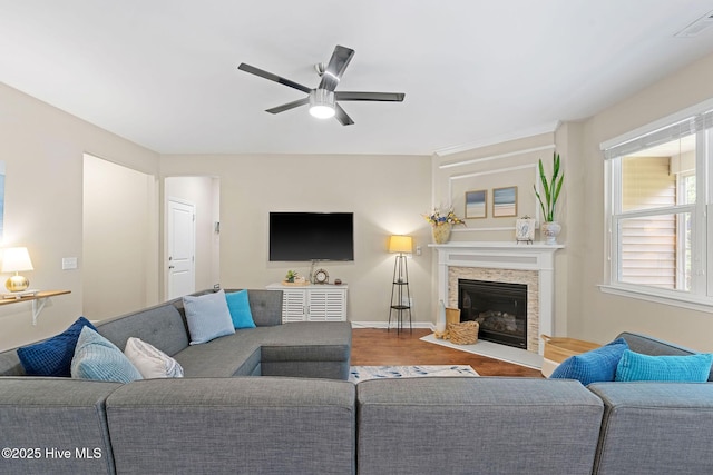 1699 Haldon Ln SE, Bolivia, NC 28422 - living area featuring a ceiling fan, baseboards, wood finished floors, and a fireplace