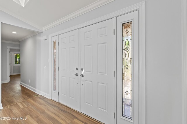 995 Chadwick Shores Dr, Sneads Ferry, NC 28460 - entrance foyer with baseboards, wood finished floors, crown molding, lofted ceiling, and recessed lighting