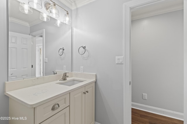 995 Chadwick Shores Dr, Sneads Ferry, NC 28460 - bathroom with crown molding, wood finished floors, baseboards, and vanity