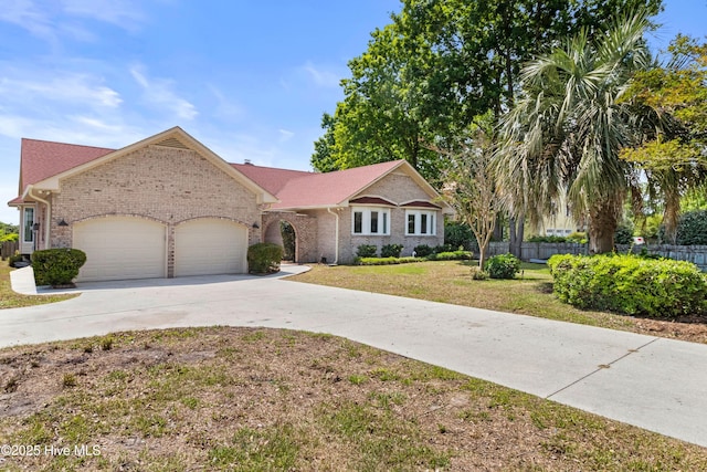 995 Chadwick Shores Dr, Sneads Ferry, NC 28460 - single story home with brick siding, driveway, and a garage