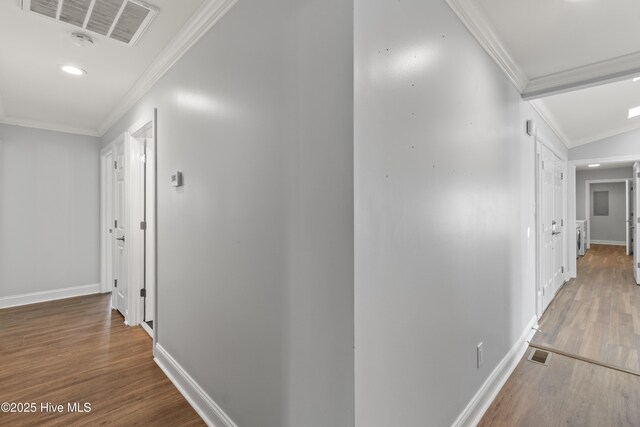 995 Chadwick Shores Dr, Sneads Ferry, NC 28460 - hall with crown molding, wood finished floors, baseboards, and recessed lighting