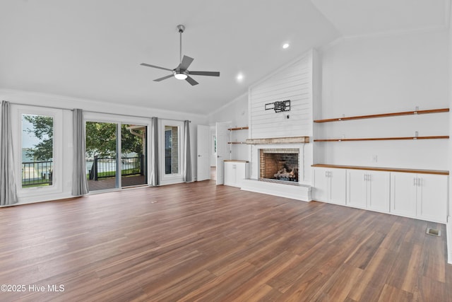 995 Chadwick Shores Dr, Sneads Ferry, NC 28460 - unfurnished living room with a fireplace, ceiling fan, ornamental molding, wood finished floors, and recessed lighting