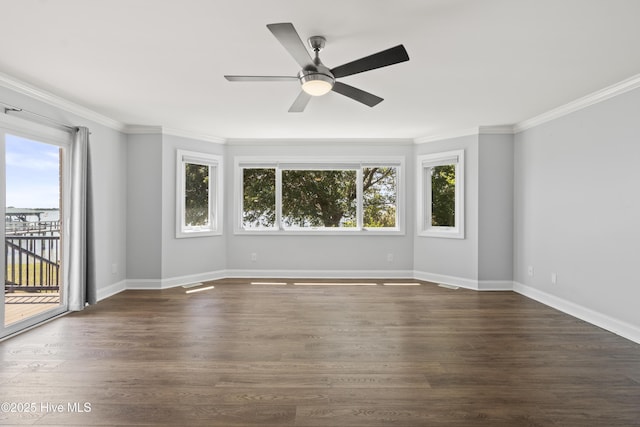 995 Chadwick Shores Dr, Sneads Ferry, NC 28460 - empty room with plenty of natural light, crown molding, ceiling fan, and dark wood-style flooring