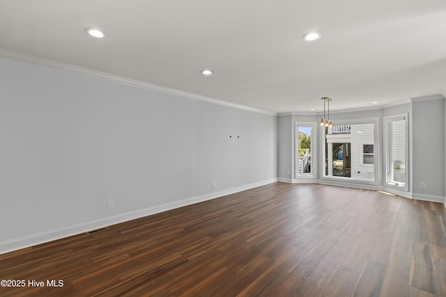 995 Chadwick Shores Dr, Sneads Ferry, NC 28460 - unfurnished living room featuring recessed lighting, baseboards, dark wood finished floors, and ornamental molding