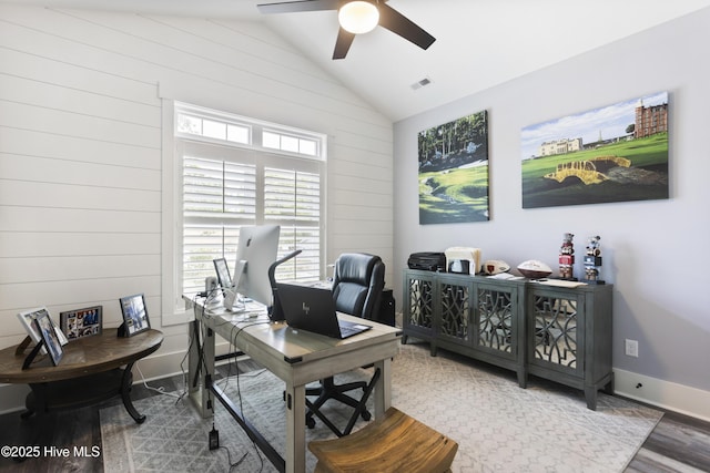 office area featuring a healthy amount of sunlight, ceiling fan, vaulted ceiling, and visible vents