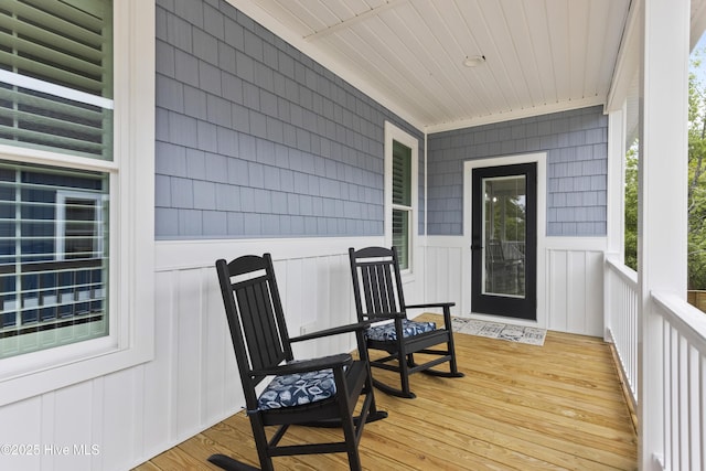 wooden terrace with a porch