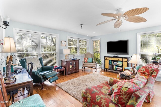 1613 E Pelican Dr, Oak Island, NC 28465 - living area featuring hardwood / wood-style floors, a ceiling fan, recessed lighting, and a healthy amount of sunlight