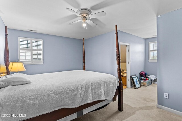 1613 E Pelican Dr, Oak Island, NC 28465 - bedroom with carpet floors, visible vents, baseboards, and ceiling fan