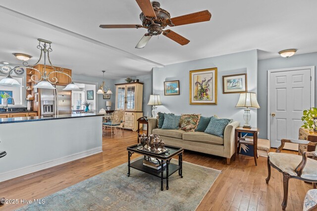 1613 E Pelican Dr, Oak Island, NC 28465 - living area with wood-type flooring and ceiling fan