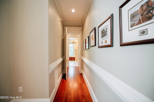 hall featuring recessed lighting, ornamental molding, and wood finished floors