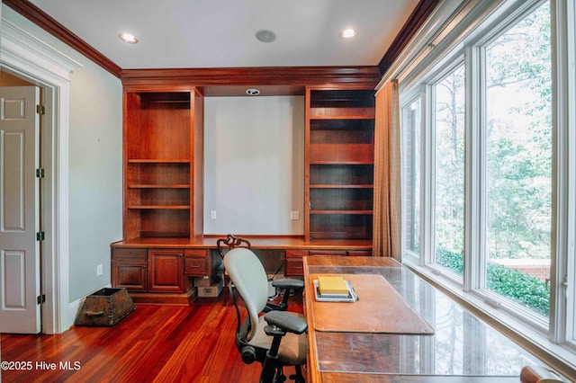 office featuring crown molding, recessed lighting, built in desk, and dark wood-type flooring
