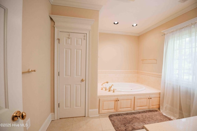 bathroom with a garden tub, tile patterned floors, baseboards, ornamental molding, and recessed lighting