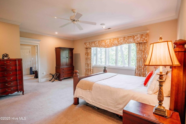 bedroom featuring crown molding, visible vents, baseboards, a ceiling fan, and carpet