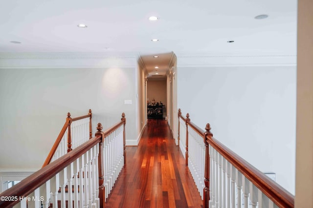 corridor featuring crown molding, recessed lighting, an upstairs landing, and wood finished floors