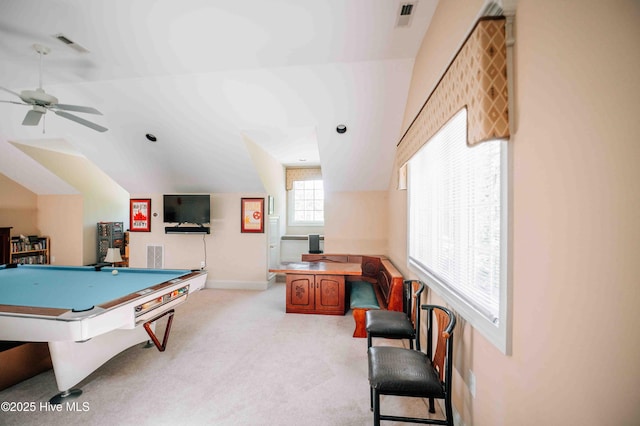 game room featuring light colored carpet, ceiling fan, vaulted ceiling, and visible vents