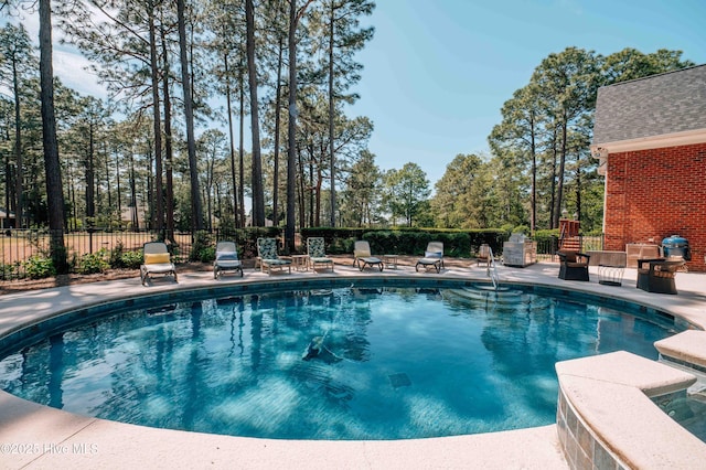 16 Mulbren Ct, Pinehurst, NC 28374 - view of swimming pool with a patio area and fence