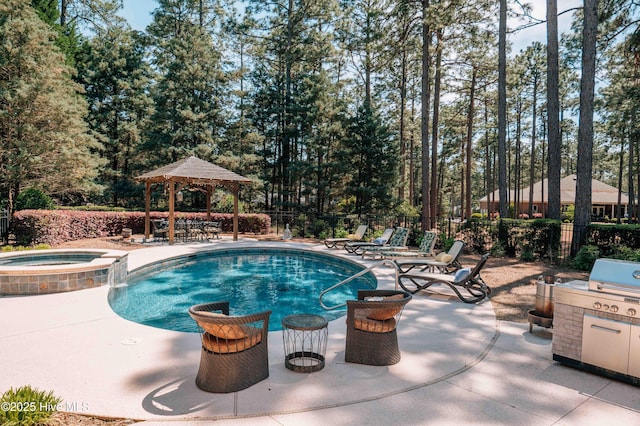 view of swimming pool featuring a gazebo, fence, a pool with connected hot tub, and a patio area