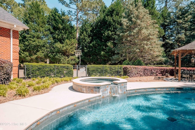 view of pool featuring a gazebo, fence, a pool with connected hot tub, and a patio