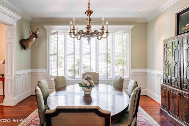 dining room with a healthy amount of sunlight, an inviting chandelier, and dark wood-style flooring